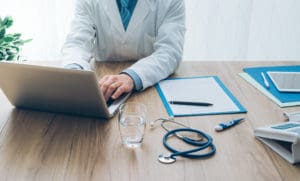 Doctor working with a laptop