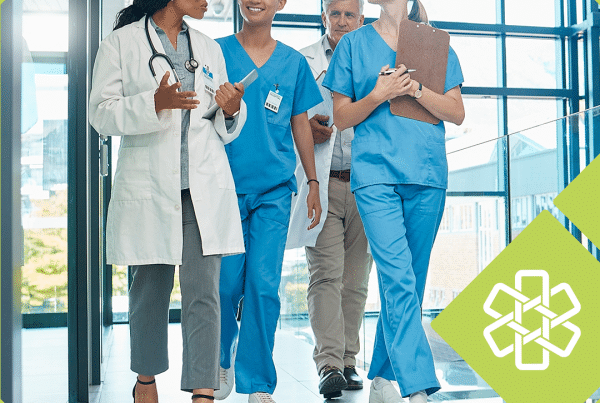 Physician and clinical staff walking together through a bright medical office hallway, framed with Unity green accents
